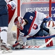 MONTREAL, CANADA - JANUARY 2: Slovakia's Denis Godla #30 reaches to cover a loose puck against Team Czech Republic during quarterfinal round action at the 2015 IIHF World Junior Championship. (Photo by Richard Wolowicz/HHOF-IIHF Images)